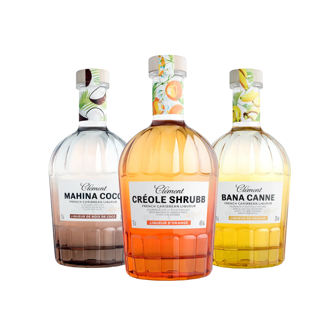 The Clément Liqueurs bundle from Spiribam USA includes Mahina Coco, Créole Shrubb, and Banane Canne, each with illustrated labels and decorative caps—ideal for Caribbean rum-inspired cocktail collections.
