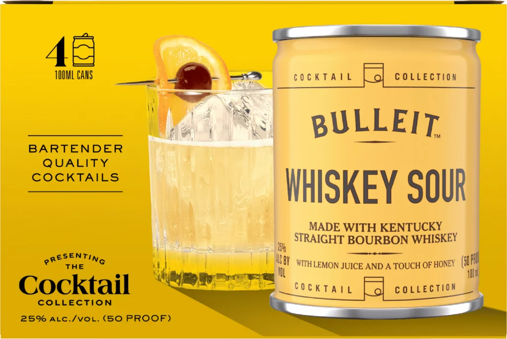 A pack of Bulleit Whiskey Sour Cocktail Cans 4 x 100mL is shown next to a glass of the yellow cocktail on ice with an orange slice and cherry, offering bartender-quality flavor at 25% ABV.