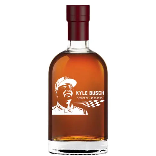 The Rebel Yell Rebel Bourbon Kyle Busch Memorial Custom Bottle features a maroon cap, an etched portrait of Kyle Busch, years 1985–2026, and checkered flags—perfect for any racing fan’s memorial display or collectible shelf.