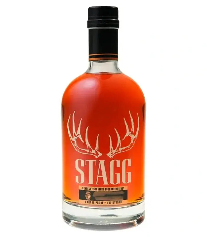A bottle of Stagg Kentucky Straight Bourbon Whiskey Batch 26B 125.2 Proof from Buffalo Trace, featuring a clear label with antlers and the word STAGG in bold letters, filled with dark amber barrel-proof bourbon.