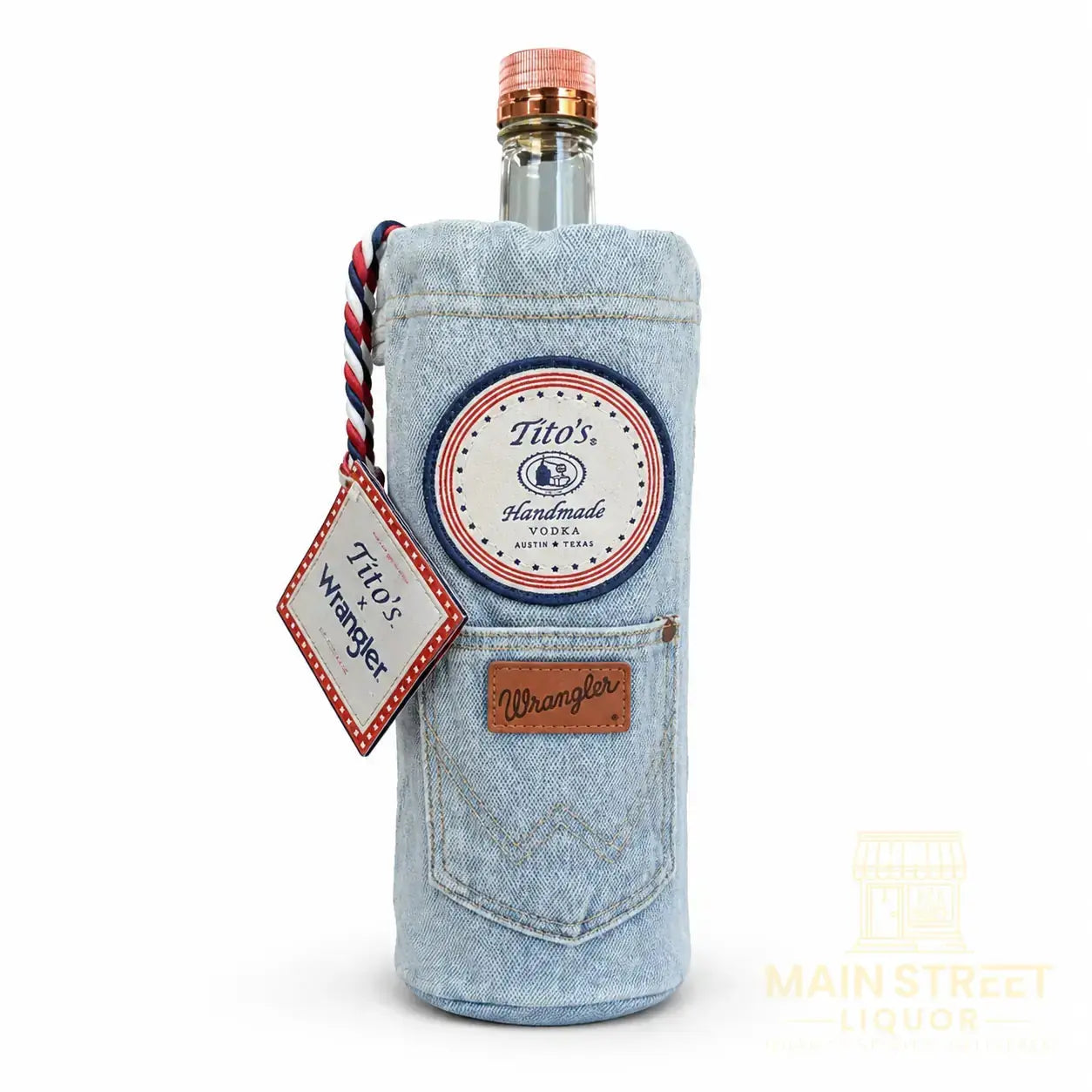 Introducing the Tito’s X Wrangler® Limited Edition 1L by Tito’s Vodka—a special gift set featuring a 1-liter bottle of Tito’s Vodka wrapped in a light blue Wrangler denim sleeve. This classic blue jeans-inspired sleeve is detailed with a patch, braided tag labeled “Titos x Wrangler,” a small front pocket, and topped off with an authentic-looking leather-like Wrangler label above the pocket for an extra-special touch.