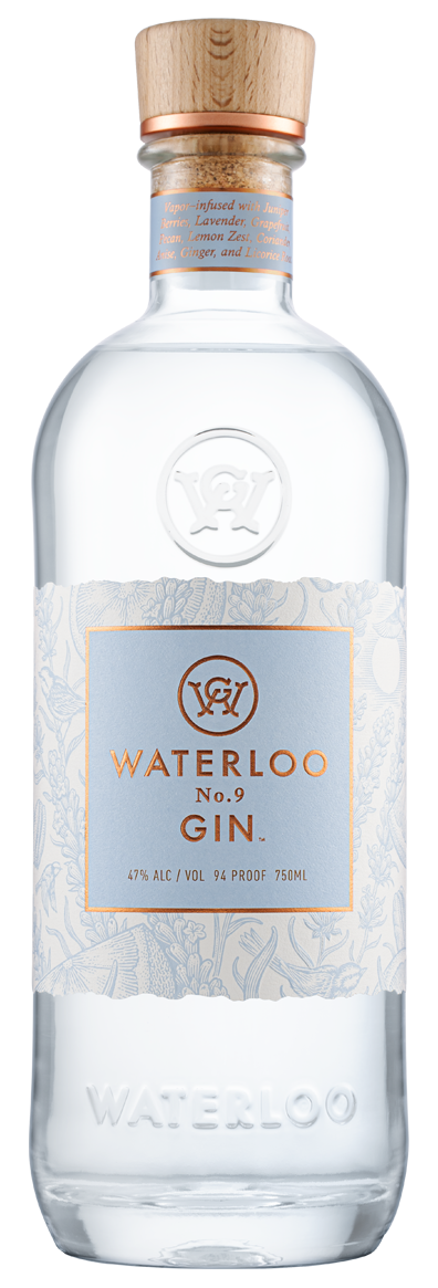 A clear glass bottle of Waterloo No.9 Gin by Waterloo Gin, with a wooden cap and a light blue label featuring botanical designs and gold accents. This Texas Hill Country gin is 47% ABV (94 proof, 750ml).