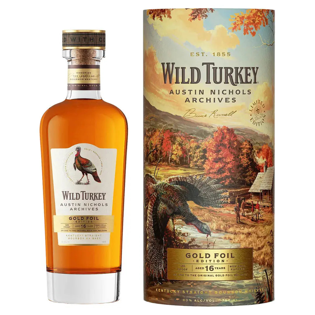 A bottle of Wild Turkey Austin Nichols Archives Gold Foil Edition 16 Year Old Bourbon stands beside its vibrant box, featuring a wild turkey and autumn scenery, highlighting this limited edition release from Wild Turkey.
