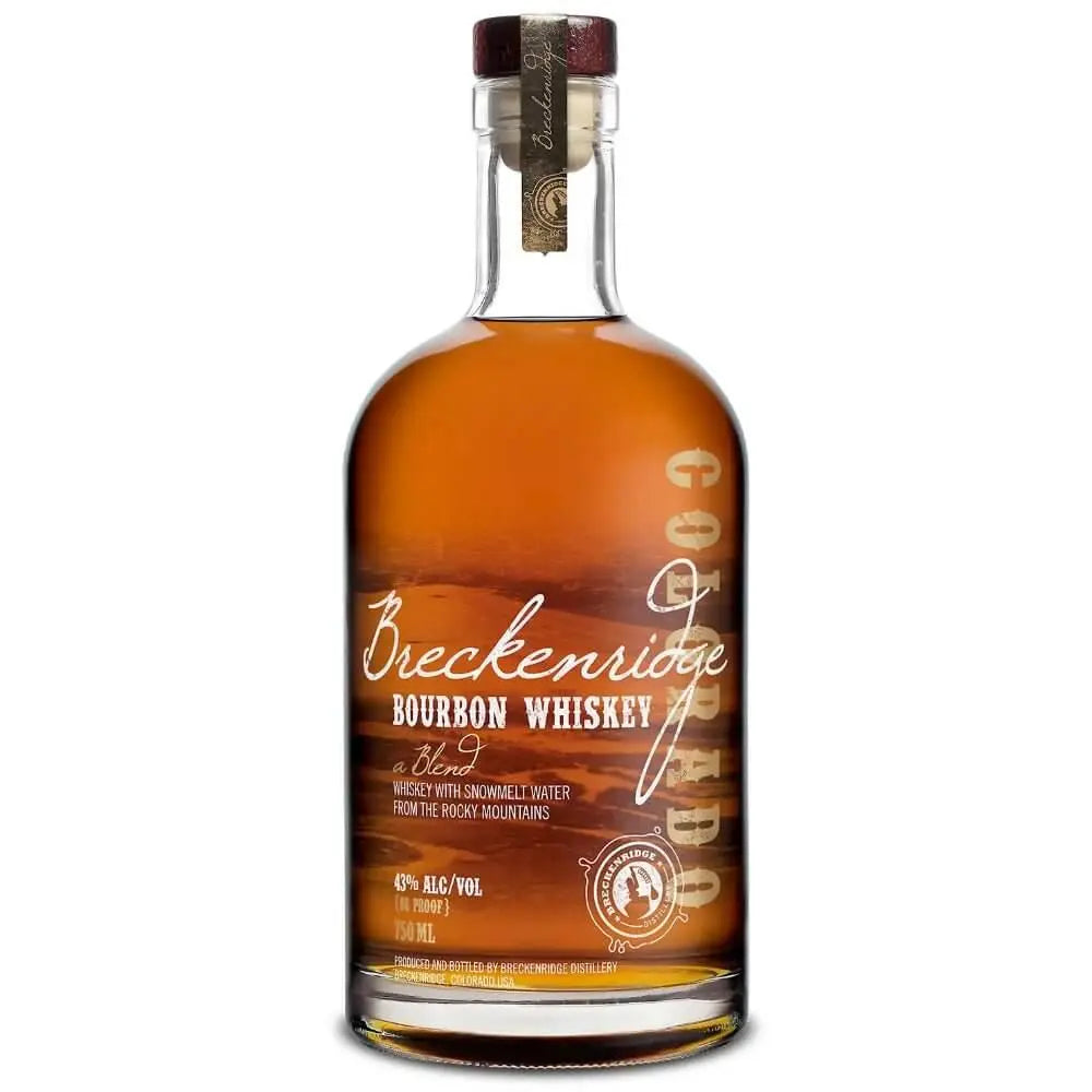 A bottle of Breckenridge Bourbon Whiskey by Breckenridge Distillery, featuring a wooden cap, gold seal, high-rye mash bill, Rocky Mountain snowmelt water, and 43% ABV.